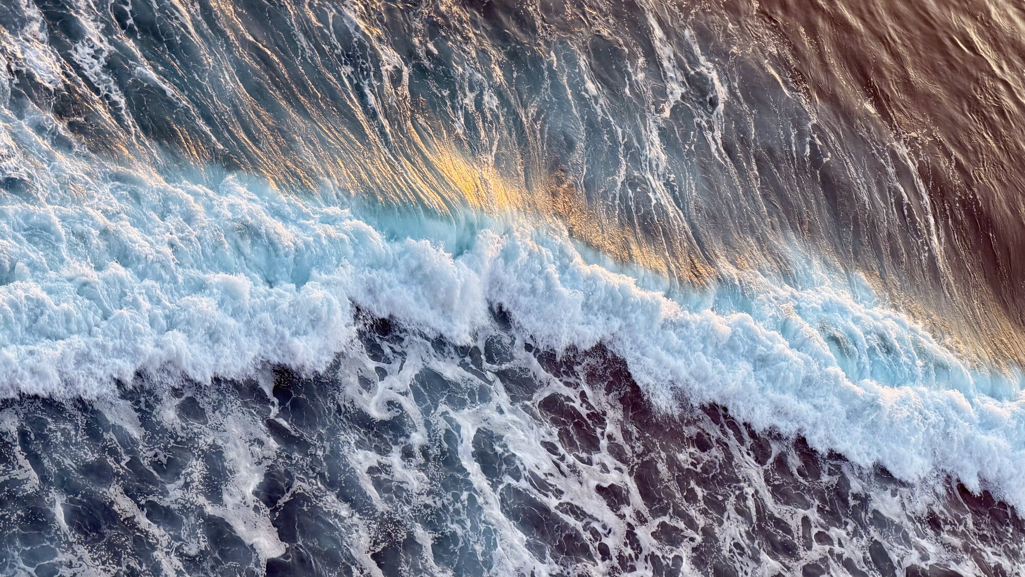 Waves rolling in, seen from above
